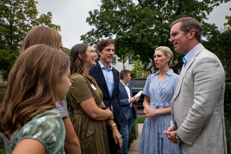 Chaz Molder (center) and Gov. Andy Beshear speak at a fundraising event in Nashville, Oct. 3, 2026