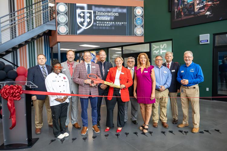 Ribbon cutting and teachers at innovation center
