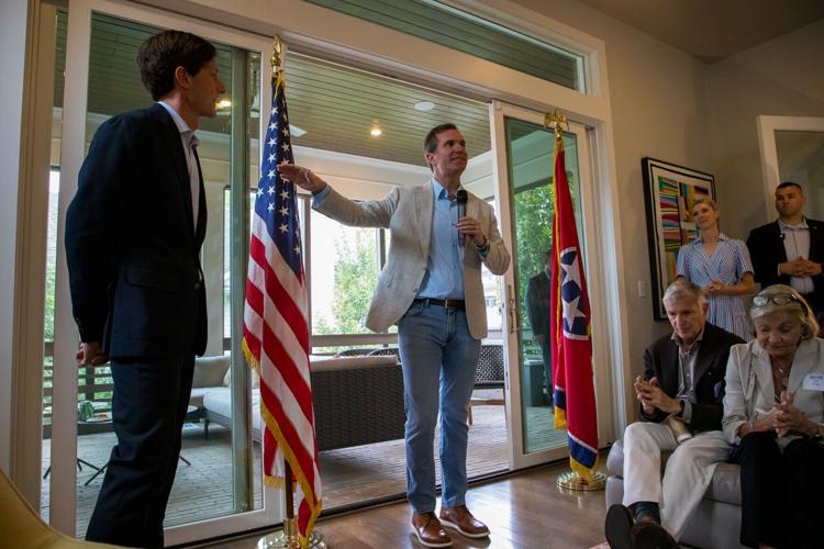 Gov. Andy Beshear (center) speaks at a fundraising event in Nashville, Oct. 3, 2026