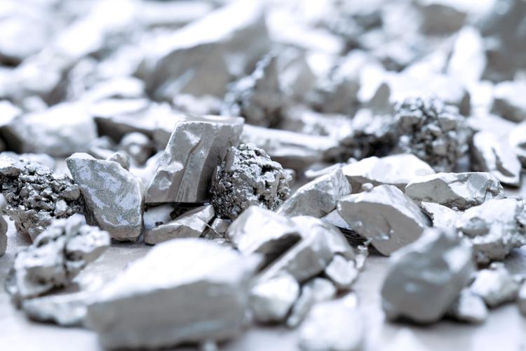 lump of silver or platinum on a stone floor