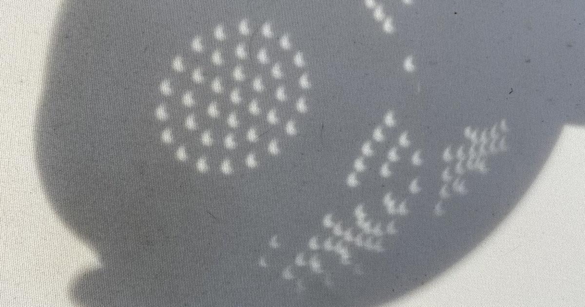Shadow of colander during partial solar eclipse | | willistonobserver.com