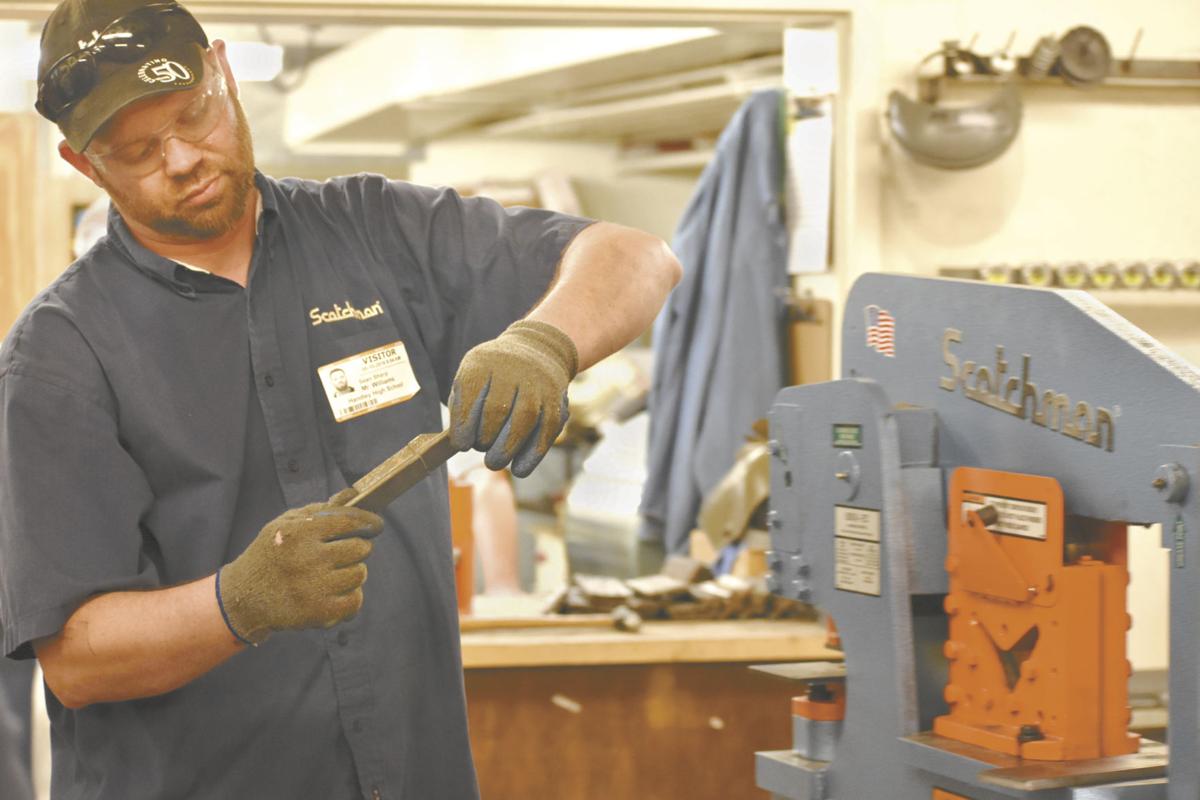 Business, Handley join to win ironworker machine in contest News