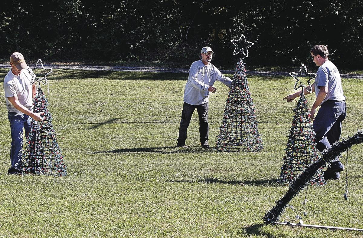 frederick county parks and recreation staff members mike reynolds from left danny casiano and dan pidgeon move the tops of lighted christmas trees while - Frederick Christmas Show frederick county parks and recreation staff members mike reynolds from left danny casiano and dan pidgeon move the tops of lighted christmas trees while - Frederick Christmas Show