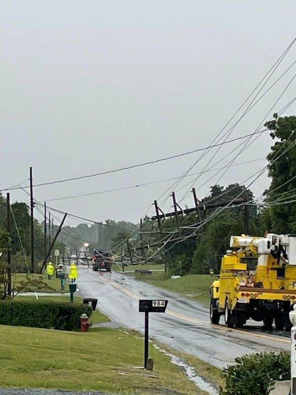 Powerful storm topples about 2 dozen power poles along Greenwood