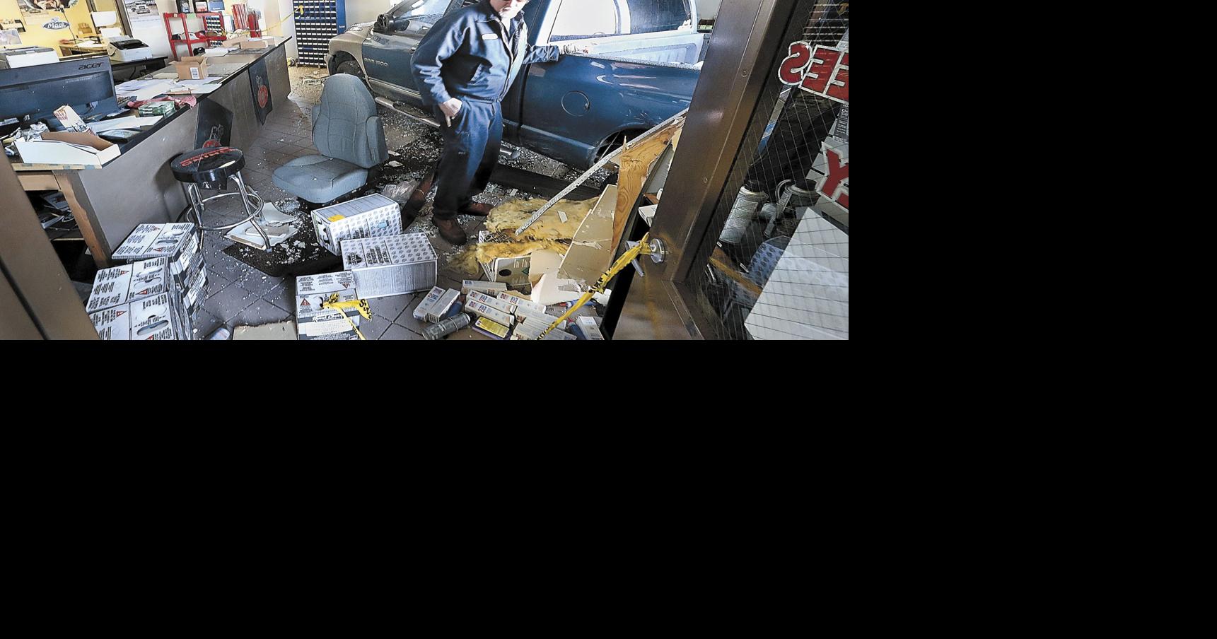Man charged with reckless driving after truck crashes into business ...