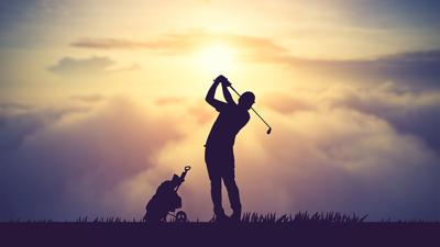 Golfer at sunrise