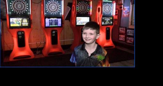 8-year-old dart player challenges himself against adult competition - Vimarsana News