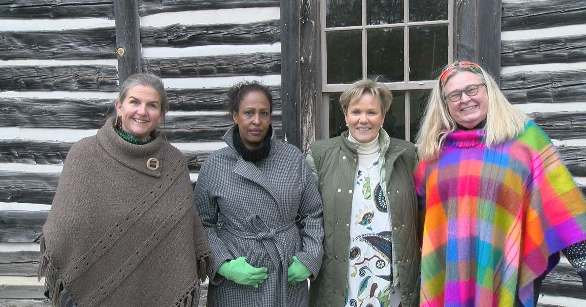 Travelers from Denmark visit historic log cabin in Mole Lake