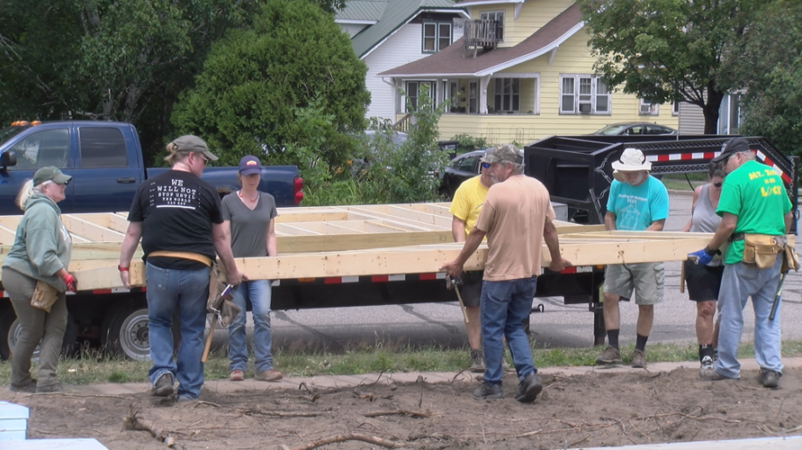 Volunteers and students helping Habitat for Humanity News