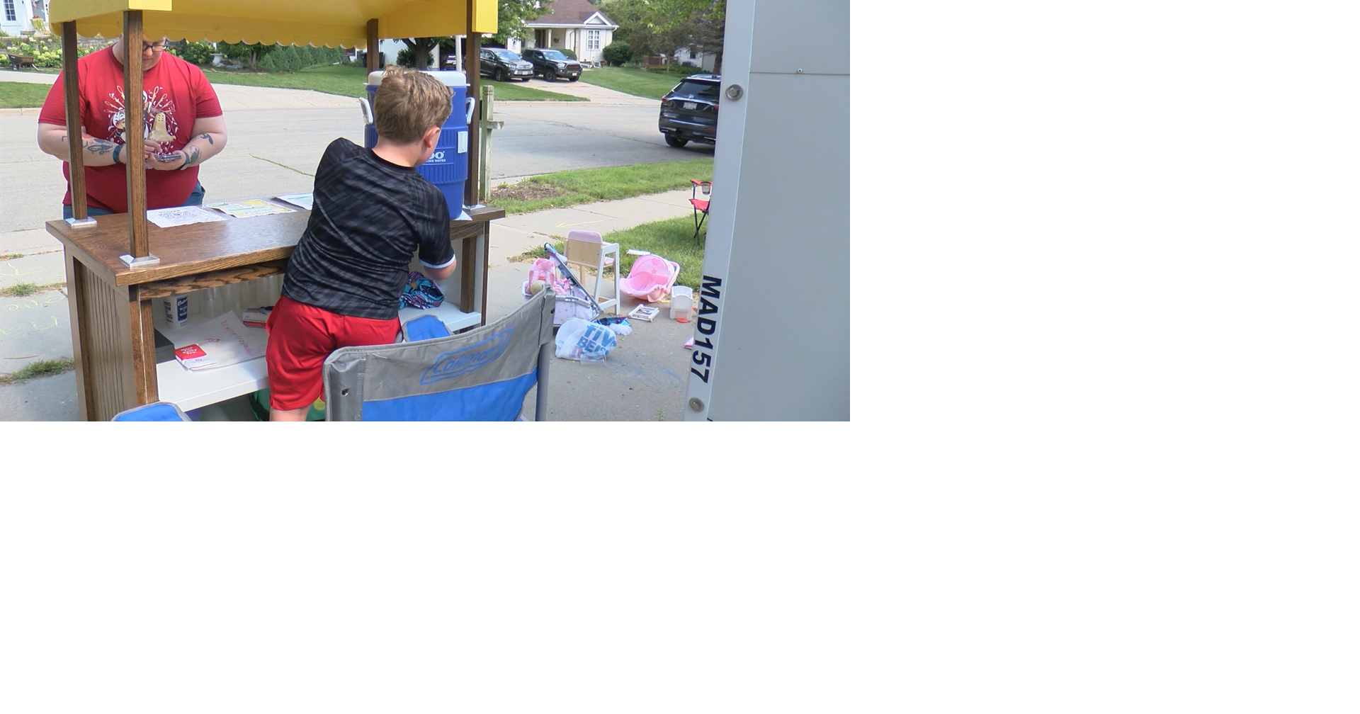 Young entrepreneur raising money via lemonade stand