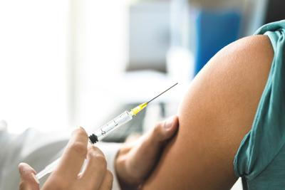 What to know about getting updated Covid-19 booster, flu shot at the same time