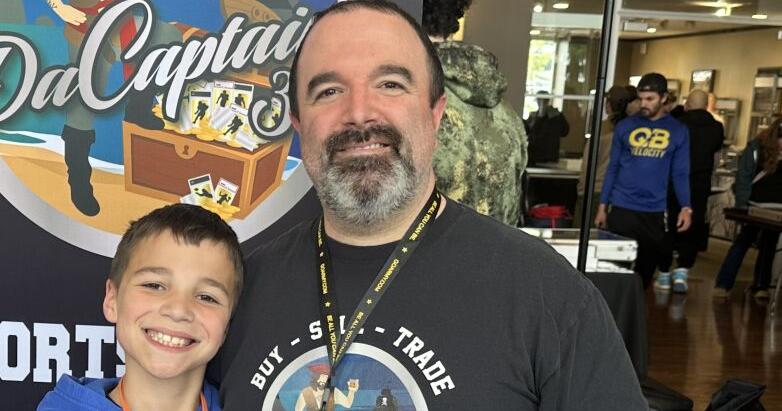 SHOWING HIM THE ROPES: Burrillville High boys basketball head coach Kevin Randall watches with pride as 9-year-old son Grayson makes name for himself in sports card market