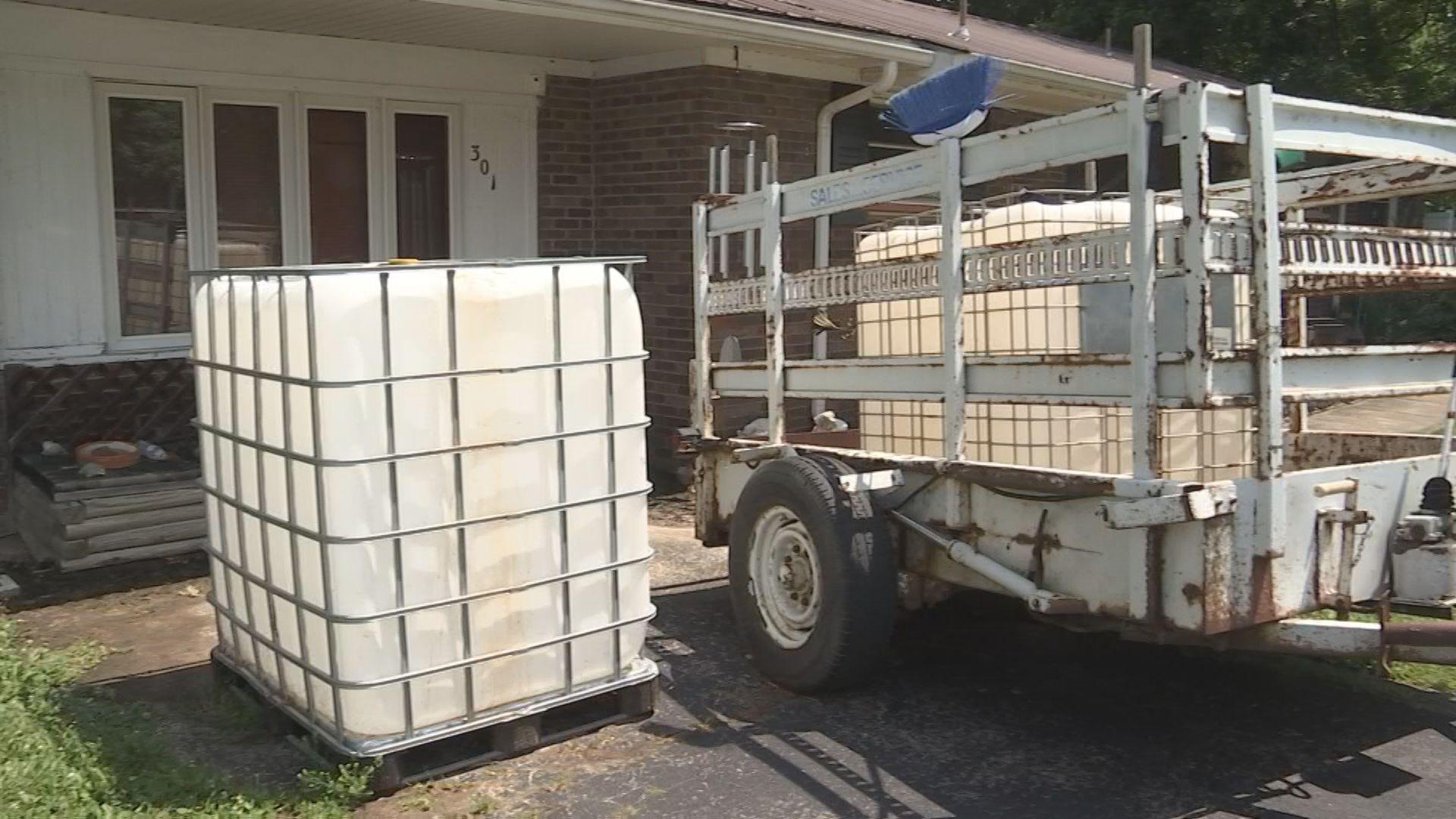 Families in Marion, Kentucky, install water tanks to make do during