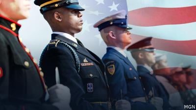 service members with american flag mgn.jpg