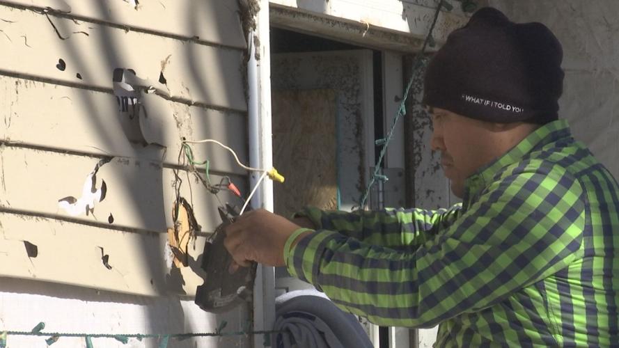 Abraham fixing wiring on house