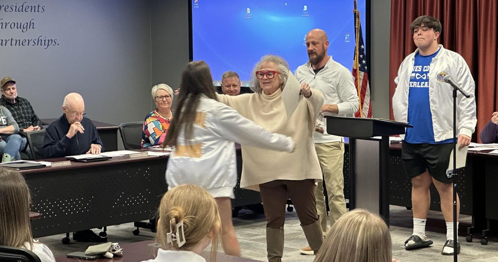 Local leaders honor cheer squad and late artist during monthly meeting - Vimarsana News