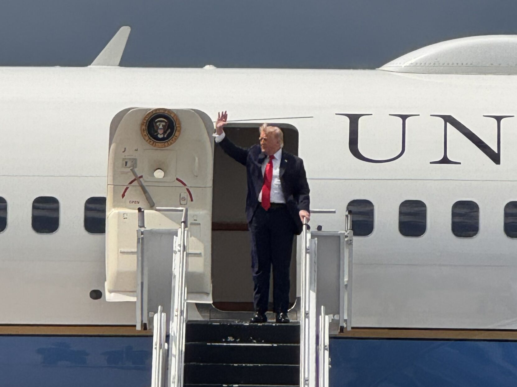President Donald Trump waves to the crowd in Chippewa County