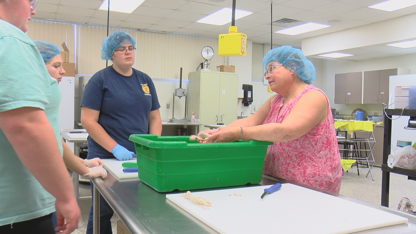 UWRiver Falls students process chickens from farmers affected by