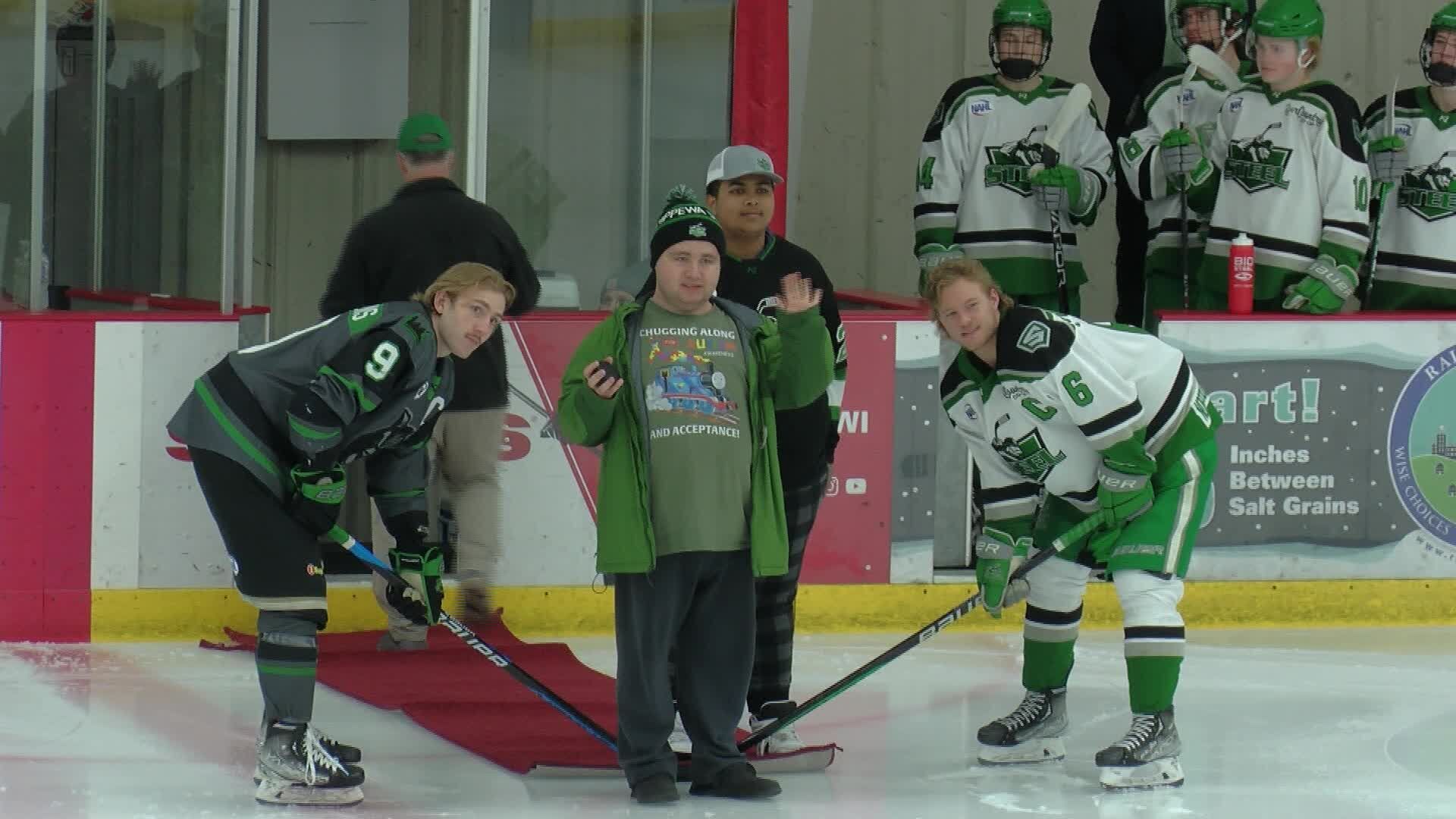 Chippewa Falls Transition Academy students drop honorary puck at