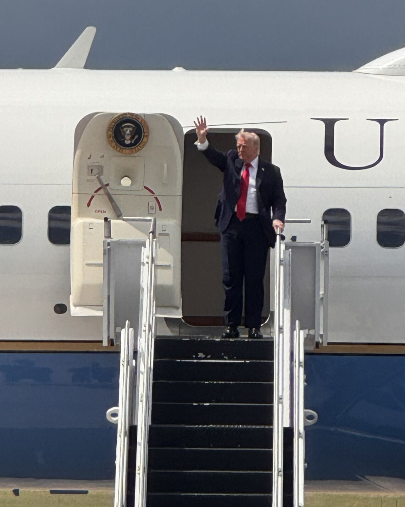 President Donald Trump waves to the crowd in Chippewa County