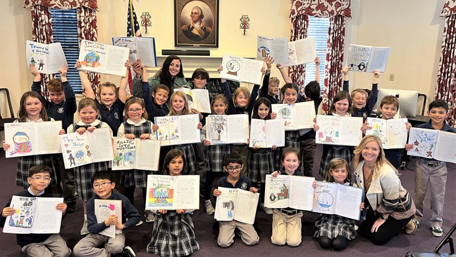 The Worcester Prep second grade class proudly displayed their published collection of stories in front of family and friends on March 9 during a book signing. Courtesy Worcester Preparatory School.