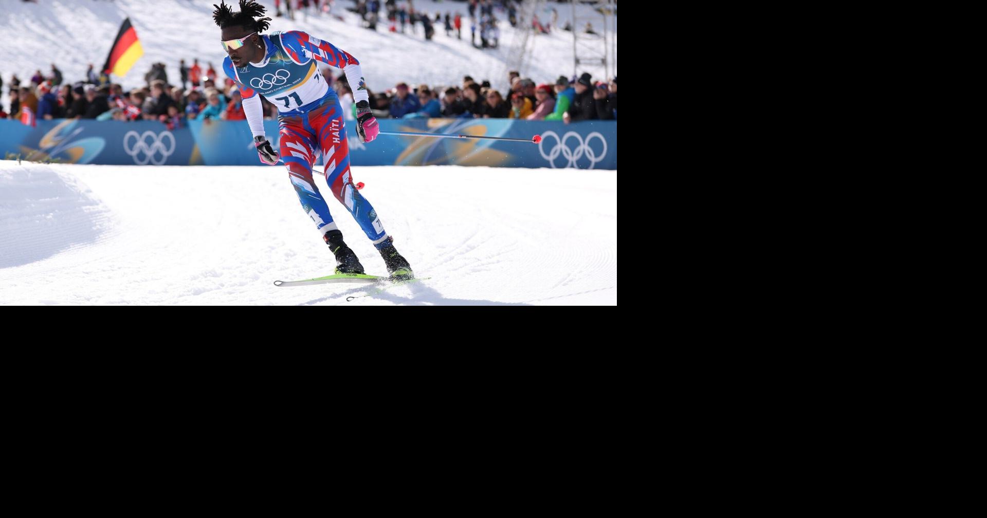 Haiti's first Olympic cross-country skier celebrated by crowd after jubilant finish in men's skiathlon