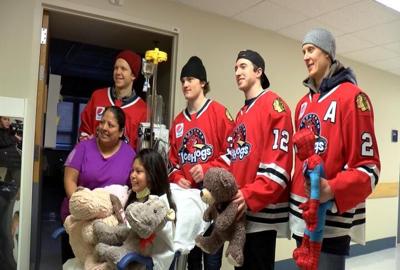 Rockford IceHogs players deliver teddy bears to Mercyhealth