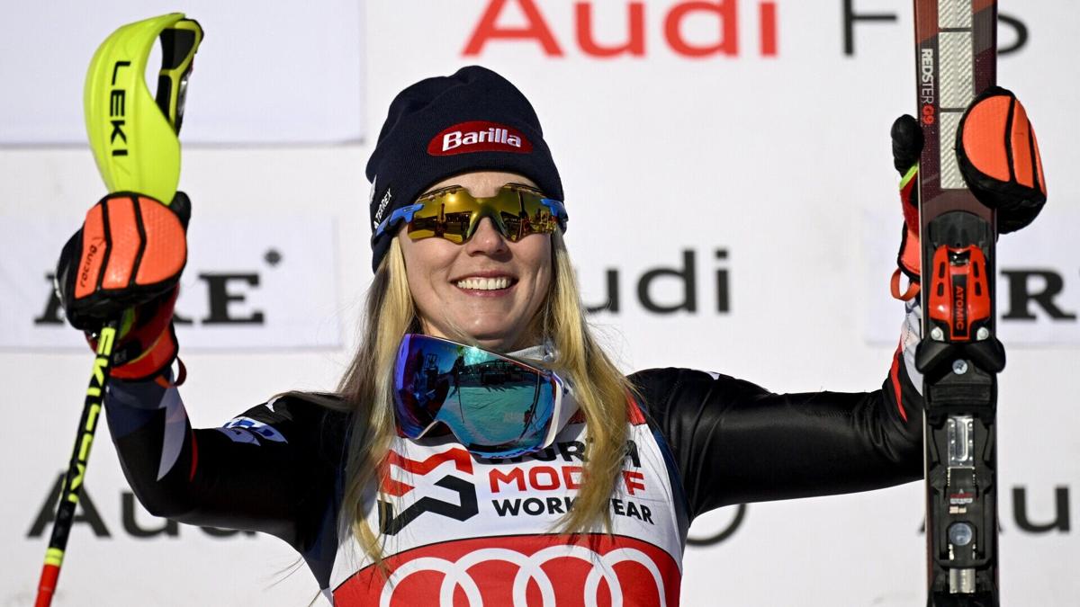 Winner USA's Mikaela Shiffrin celebrates on the podium after the Women
