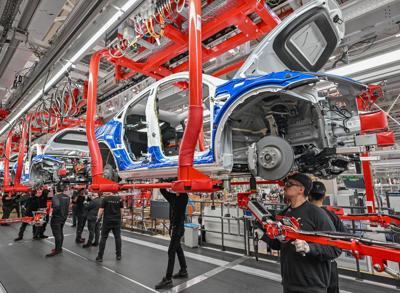 Tesla delivered a record number of cars last quarter, beating expectations