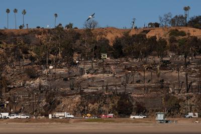 Southern California鈥檚 first rainfall of the year could help or hurt wildfire victims as fire spreads in San Diego area
