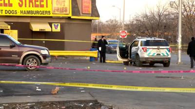 Two Chicago police officers shot on overnight shift while ordering at a hot dog stand