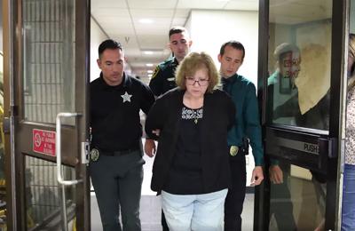 Bond set at $154,000 for Florida woman arrested in the shooting death of a Black mother who knocked on her door