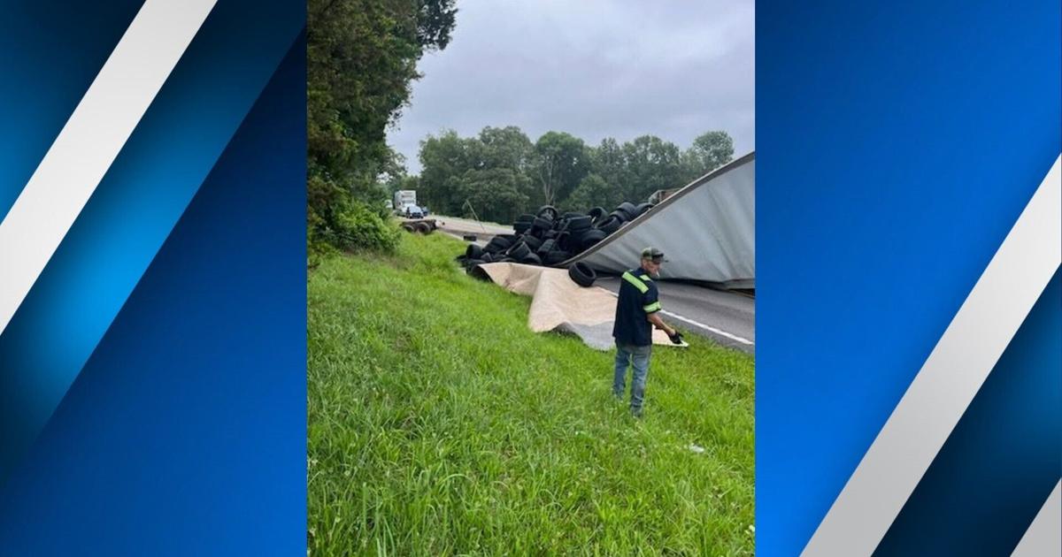 Semi hauling tires overturns in Crittenden County