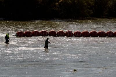 Justice Department planning legal action against Texas over floating border barrier