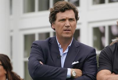 Tucker Carlson sent a racist text to a producer: 'It's not how white men fight'