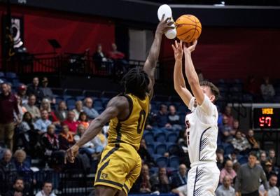 College basketball player blocks shot with unorthodox method – using his shoe