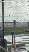 Powerful winds tear off roof of a nearby factory in Jackson, TN