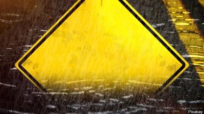 heavy rain road sign