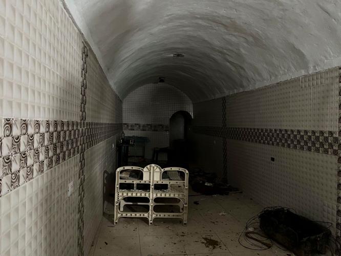 A barred gate, a musty chamber and dirty dishes: Inside the underground compound where Israel says hostages were held