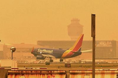 FAA delays flights into New York and Newark airports as Canadian wildfire smoke spreads