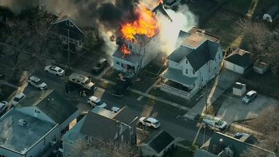 Bodies of 5 victims and apparent shooter recovered from Philadelphia-area house set on fire as responding police were shot