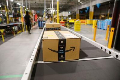 Amazon starts trading on the Dow Jones Industrial Average