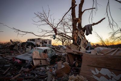 Dawson Springs mother clutched her 2 kids in bed when the storm lifted her mattress into the air
