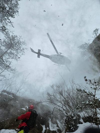 Four students rescued by helicopter in snowy conditions in "one of the most dangerous rescues ever" for search crew
