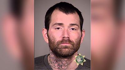 Oregon suspect, who escaped while fully shackled, taken into custody after found stuck in mud