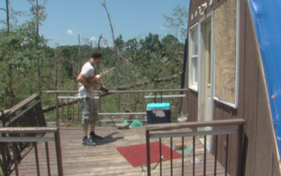 Homeowner looking at storm damage