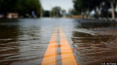 flooded road, water over road