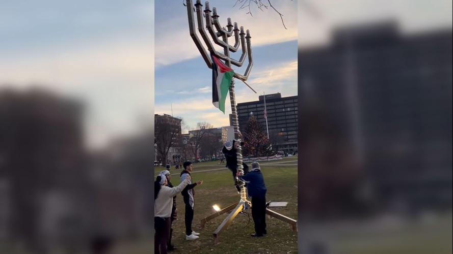 New Haven police investigate draping of a Palestinian flag over a menorah near Yale campus