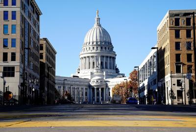 Man accused of bringing guns to the Wisconsin Capitol grounds pleads not guilty to misdemeanor firearm charge