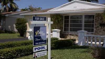 Mortgage rates remain volatile, tick down after climbing for two weeks